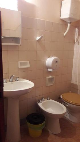 a bathroom with a sink and a toilet at Hospedaje TUUKAY in Tilcara