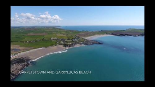 an aerial view of a beach and a body of water at Ocean View,Kinsale, Hosted by Exquisite holiday homes, sleeps 22 in Kinsale