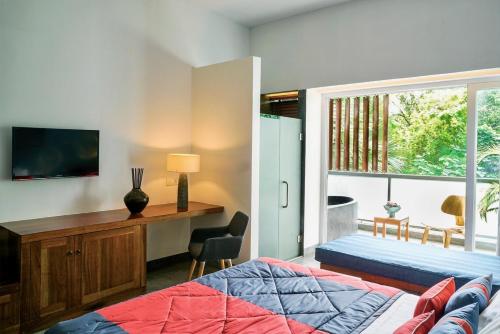 Postel nebo postele na pokoji v ubytování Rambutan Resort – Phnom Penh