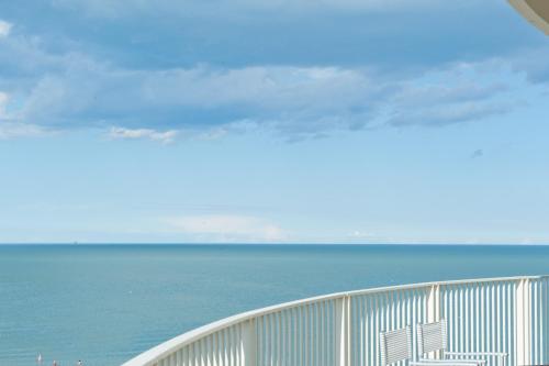 a view of the ocean from a balcony at Hotel Torremaura in Milano Marittima