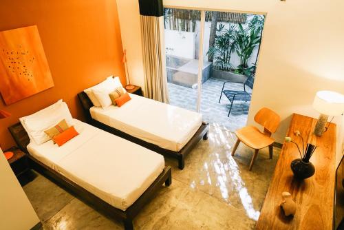 Postel nebo postele na pokoji v ubytování Rambutan Resort – Phnom Penh