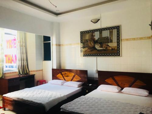 En eller flere senge i et værelse på Thien Thanh Hotel