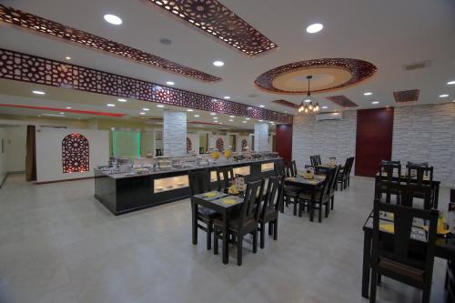 En restaurant eller et spisested på Oasis Najran Hotel