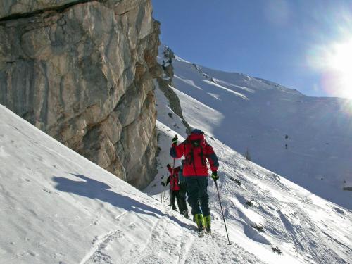 two people hiking up a snow covered mountain at Hotel Waldheim in Valle Di Casies