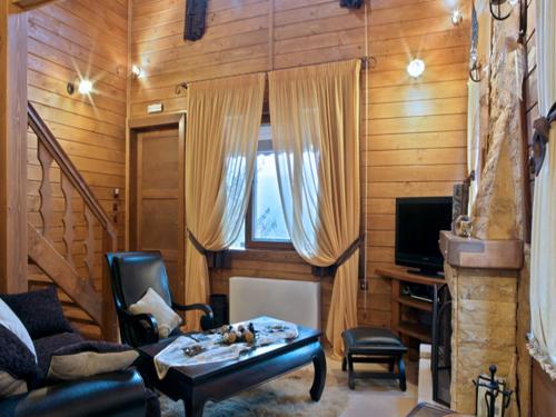 a living room with a couch and a table at Feggarognemata Suites in Ano Trikala
