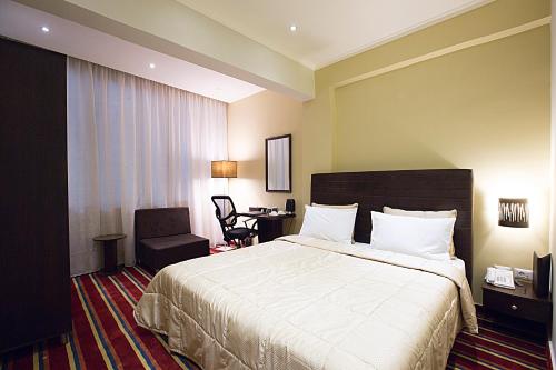 Postel nebo postele na pokoji v ubytování The J Hotel & Spa