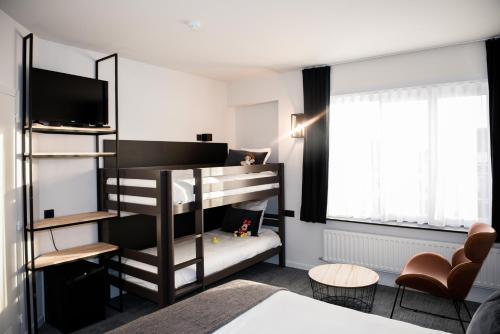 Postel nebo postele na pokoji v ubytování Hotel Carnac