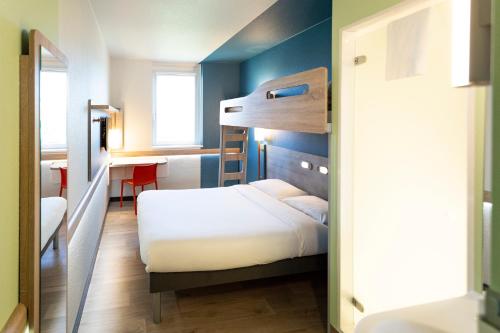 Ένα ή περισσότερα κρεβάτια σε δωμάτιο στο ibis budget Genève Aéroport