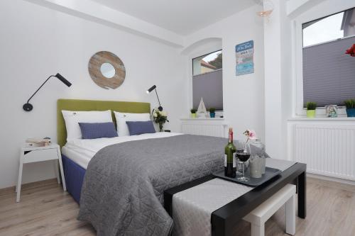 Ένα ή περισσότερα κρεβάτια σε δωμάτιο στο Apartamenty Via Mare