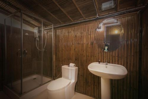 a bathroom with a toilet and a sink and a shower at Ao Nang Bamboo Resort in Ao Nang Beach