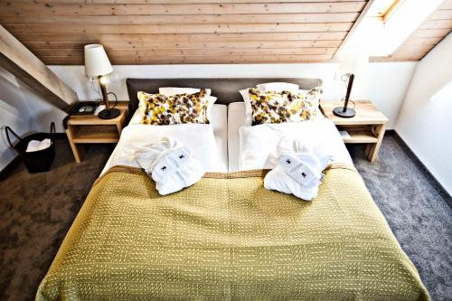 Postel nebo postele na pokoji v ubytování Ferienhaus Hotel Hirschen Horn