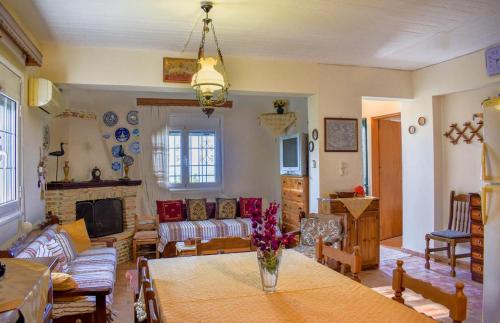 a living room with a table and a couch at Dream View Villa in Kipseli
