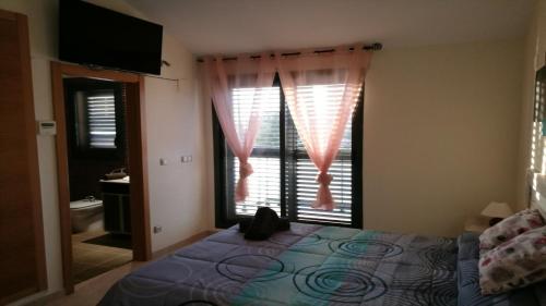 Ένα ή περισσότερα κρεβάτια σε δωμάτιο στο Excepcional Chalet adosado de lujo "Una Escapada al Paraíso"