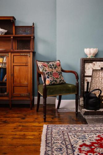 a chair with a pillow in a living room at Elizabeth Fort in Cork