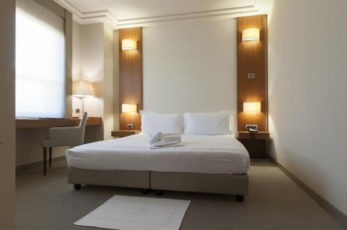Postel nebo postele na pokoji v ubytování Hotel Barrage