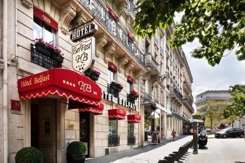 a building with signs on the side of a street at Belfast in Paris