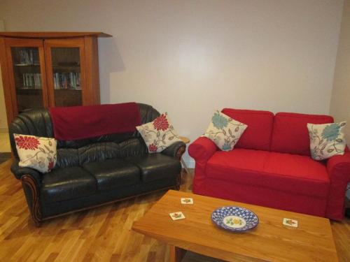a living room with a couch and a coffee table at The Goldings in Lewes