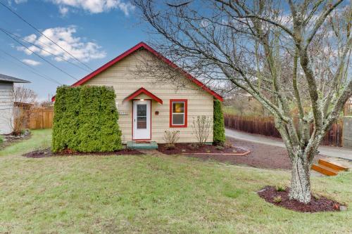 a small white house with a red roof at Bay View Bungalow in Poulsbo