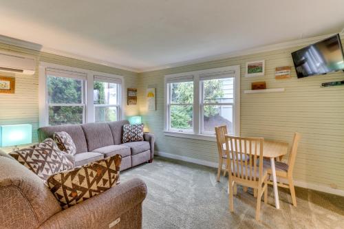 a living room with a couch and a table at Bay View Bungalow in Poulsbo