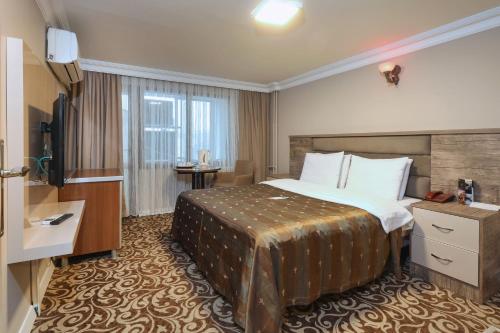 Postel nebo postele na pokoji v ubytování Balturk Hotel Sakarya
