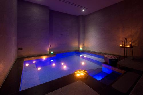 an indoor swimming pool with lights in a room at Hotel Crawford in Sant'Agnello