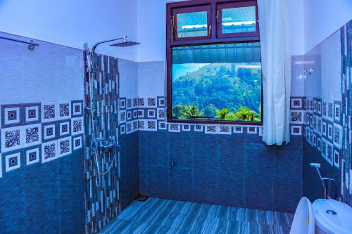 Et badeværelse på Dimuthu Home Stay