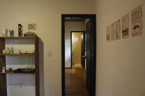 a hallway with a door leading into a room at Villa Madorna in Santana do Riacho