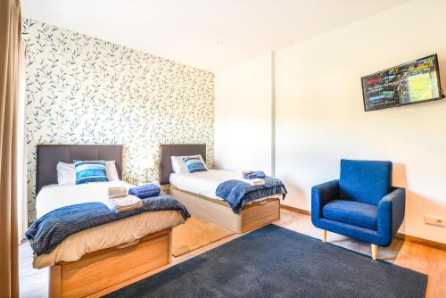 Ένα ή περισσότερα κρεβάτια σε δωμάτιο στο Vila Vale Mouro by OCvillas
