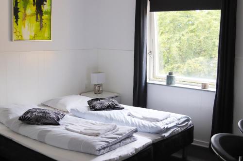 Postel nebo postele na pokoji v ubytování Kanns Hotel