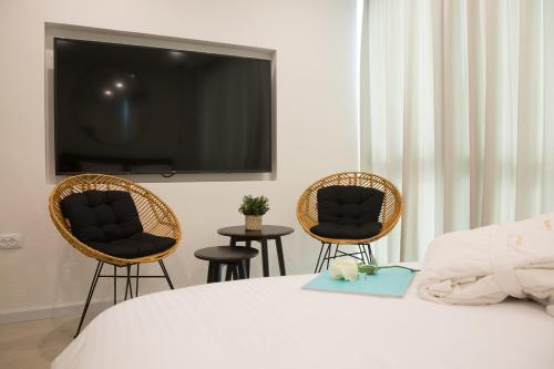 Postel nebo postele na pokoji v ubytování Suite Caesar - Neot Golf