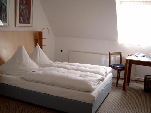 Posteľ alebo postele v izbe v ubytovaní Tagungsvilla Weißer Berg