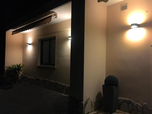 a room with two lights on the side of a building at B&B Costa Azzurra in Porto Cesareo