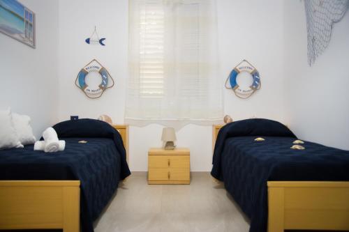 Ένα ή περισσότερα κρεβάτια σε δωμάτιο στο Casa Mare e Fiori nella Valle Dei Templi