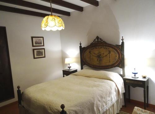 Postel nebo postele na pokoji v ubytování Casa das Paredes
