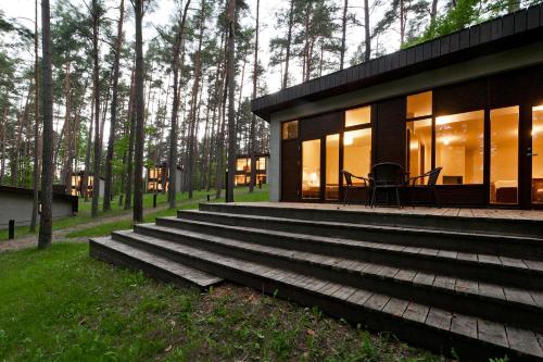 a house with steps leading up to it at Belvilis Hotel in Molėtai