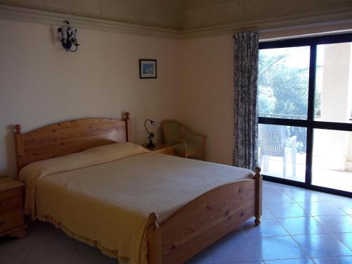 Кровать или кровати в номере San Antonio Guesthouse