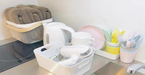 a kitchen counter with a white drying rack and utensils at ENZO / Vacation STAY 13251 in Fukuoka