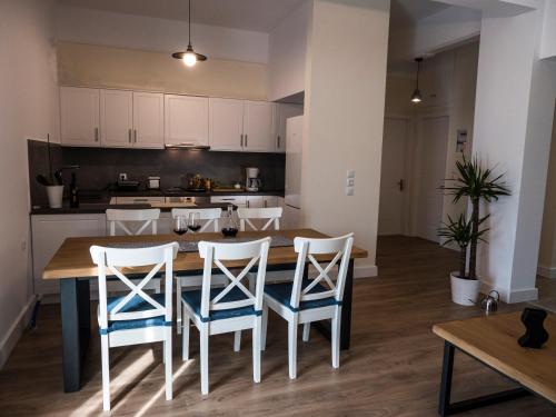 a kitchen with a table and chairs in a room at Villa Lelova in Mitikas