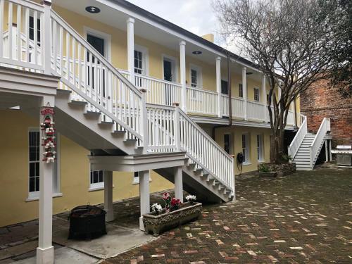 a building with white stairs on the side of it at Haunted Hotel New Orleans in New Orleans