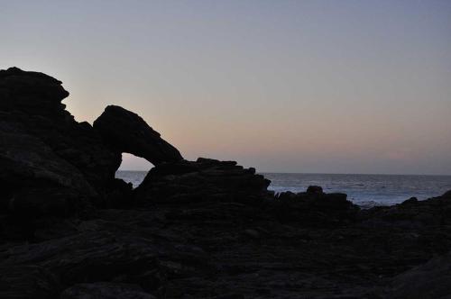 a group of rocks on a beach near the ocean at OceanLife Guesthouse and Restaurant Lüderitz in Lüderitz