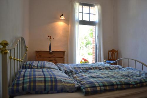 Un pat sau paturi într-o cameră la Apartments Golden Tüffel