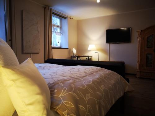
Ein Bett oder Betten in einem Zimmer der Unterkunft Ferienwohnung Sesslach Altstadt
