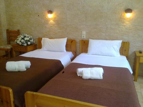 Postel nebo postele na pokoji v ubytování Dimitris Villa Hotel