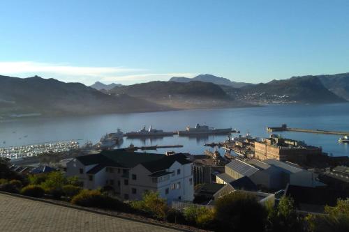 a view of a city and a body of water at Harbour Views in Simonʼs Town