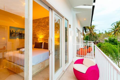 Postel nebo postele na pokoji v ubytování Cocotoa Boutique Hotel & Villa