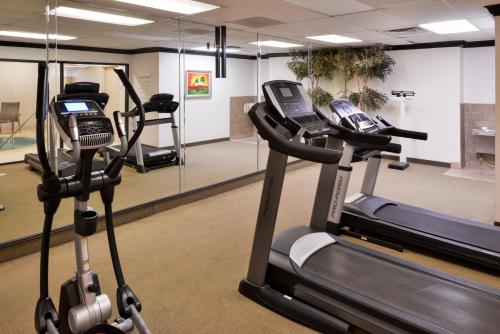 a gym with two cell phones on a treadmill at Hotel Chino Hills in Chino Hills