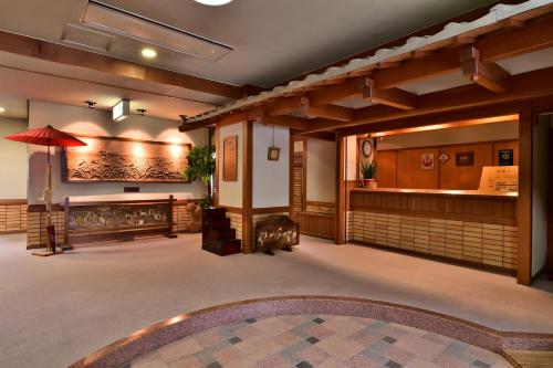 a lobby of a restaurant with a pool at Hosonokan in Hakuba