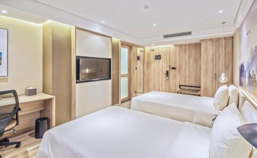 Μια τηλεόραση ή/και κέντρο ψυχαγωγίας στο Atour Hotel Nanjing Sun Yat-sen Mausoleum Scenic Area Alfalfa Garden Subway Station