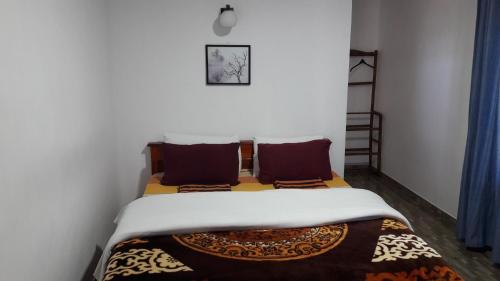 a small bedroom with a bed in a room at B&B Nuwara eliya in Nuwara Eliya