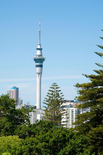 a view of the eiffel tower through the trees at Quest Ponsonby Serviced Apartments in Auckland